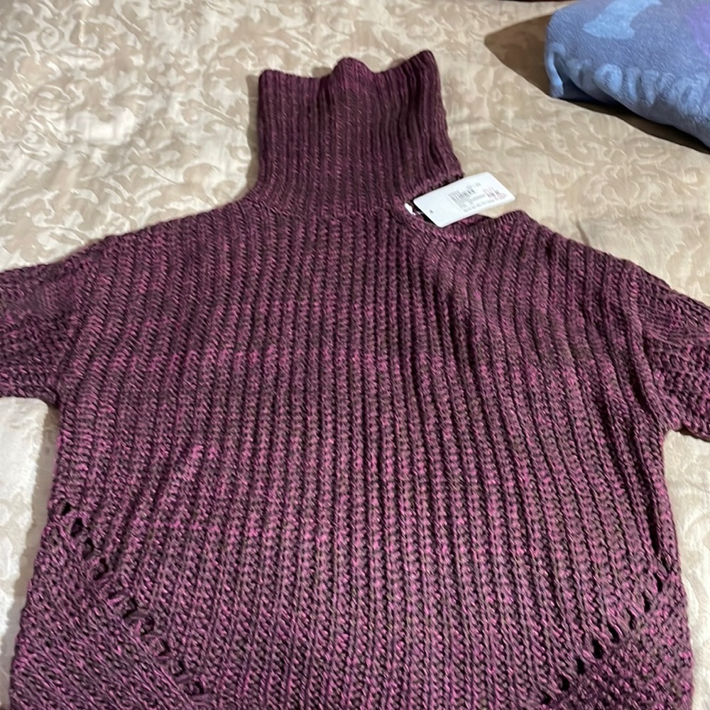 New with tags, one shoulder cut out sweater